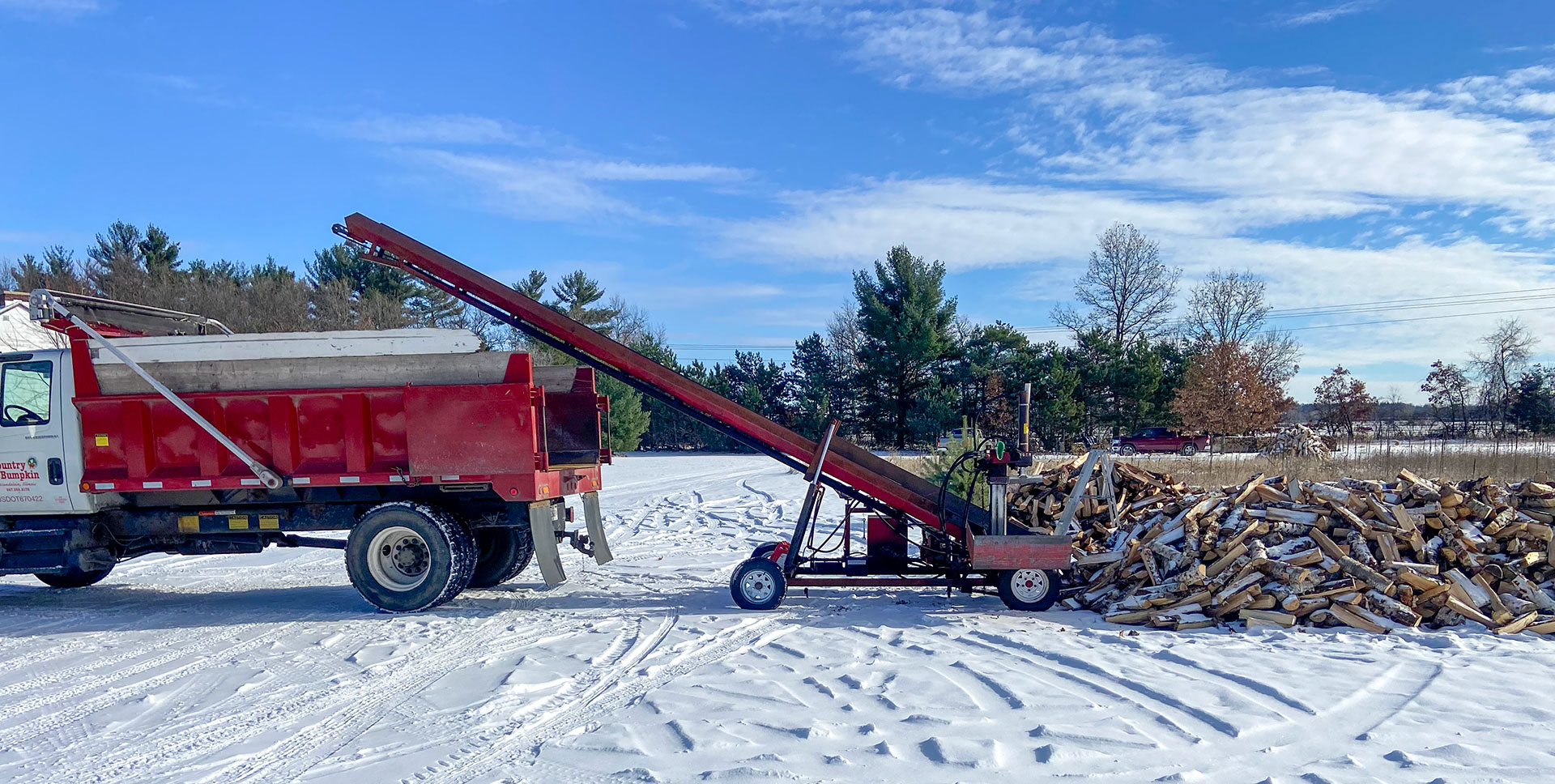 Loading Wisconsin birch and cherry firewood for the Country Bumpkin Garden Center in Hawthorn Woods, Illinois